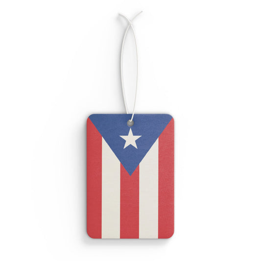 A rectangular car air freshener with a vibrant print of the Puerto Rican flag, featuring a white star on a blue background with red and white stripes.