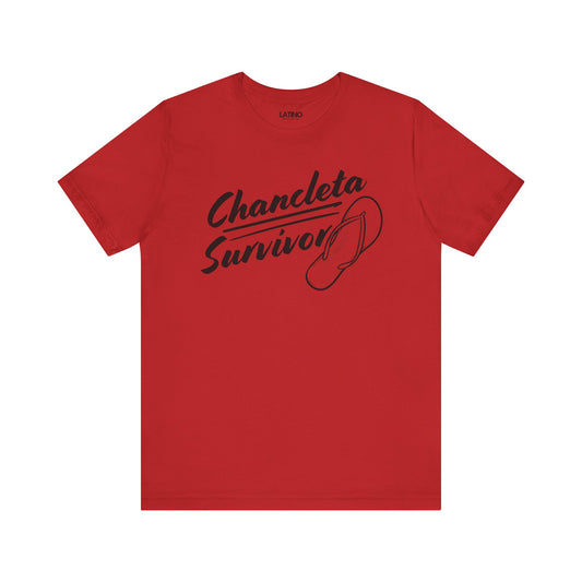 A red t-shirt with the text 'CHANCLETA SURVIVOR' and a graphic of a flip-flop on the front.