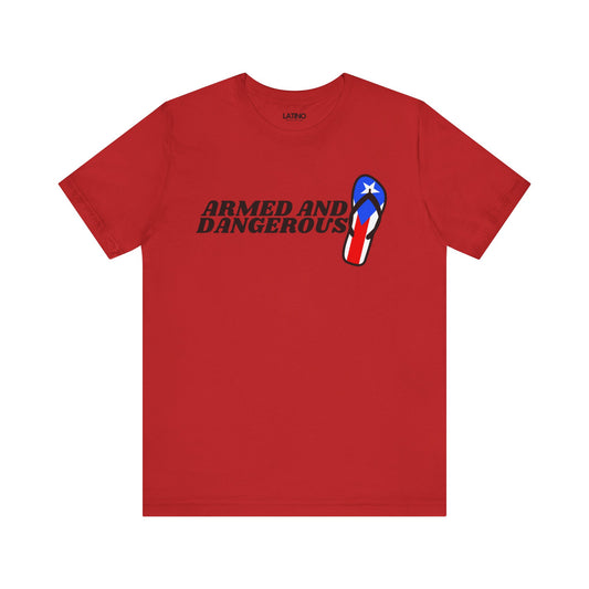 A red t-shirt with a graphic design that includes a flip-flop with the Puerto Rican flag and the text 'Armed and Dangerous' printed on it.