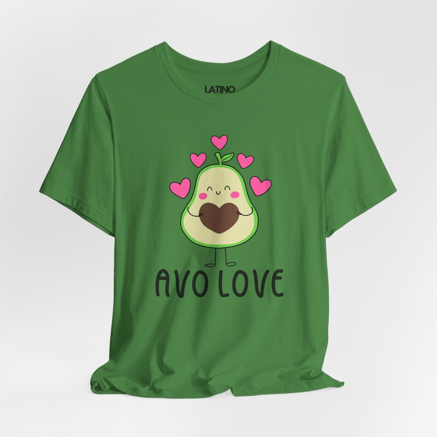Green T-shirt with a cute cartoon avocado character, surrounded by pink hearts, and the phrase “Avo Love” in bold black letters.