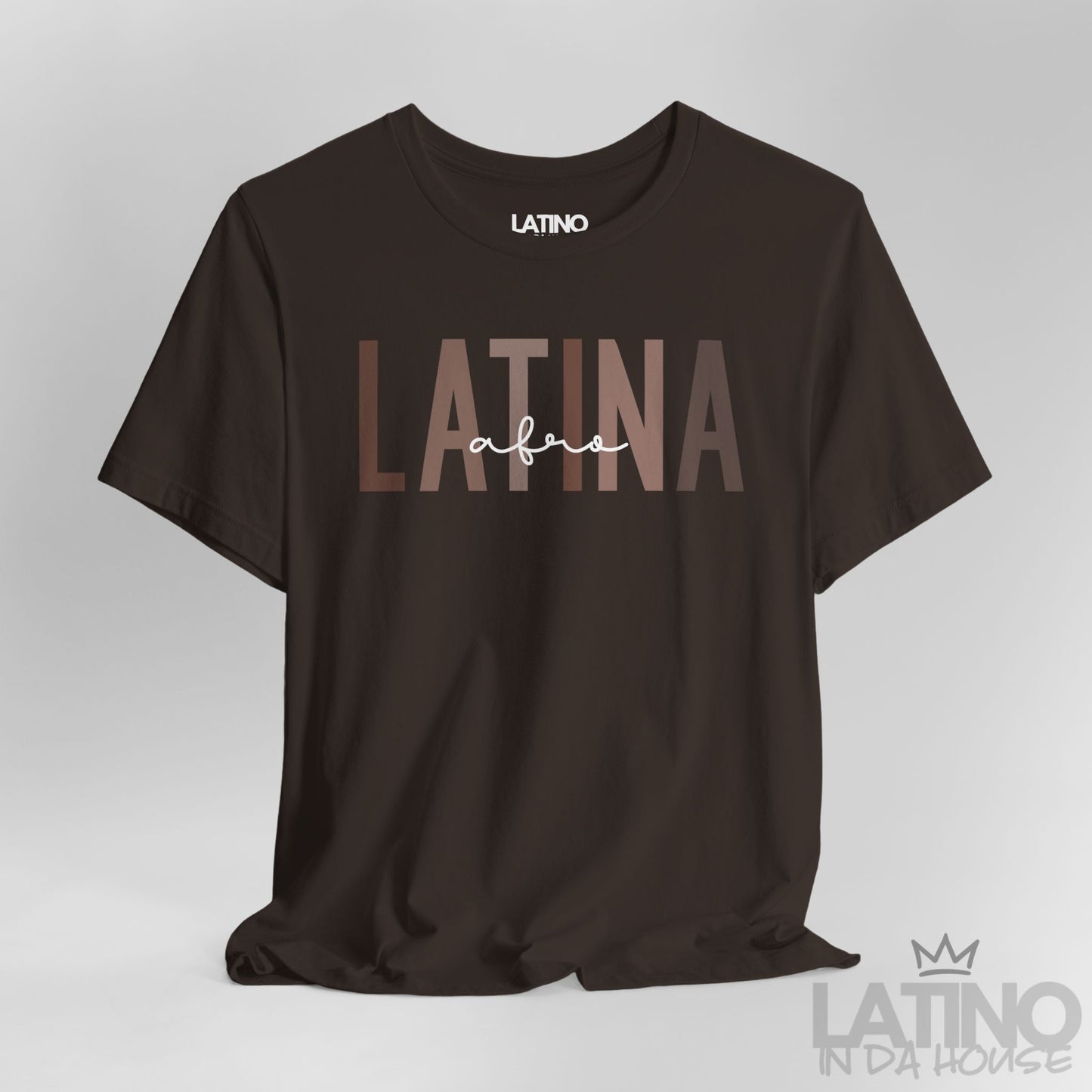 Close-up of Afro Latina T-Shirt design in bold brown text on brown cotton fabric. Latino In Da House