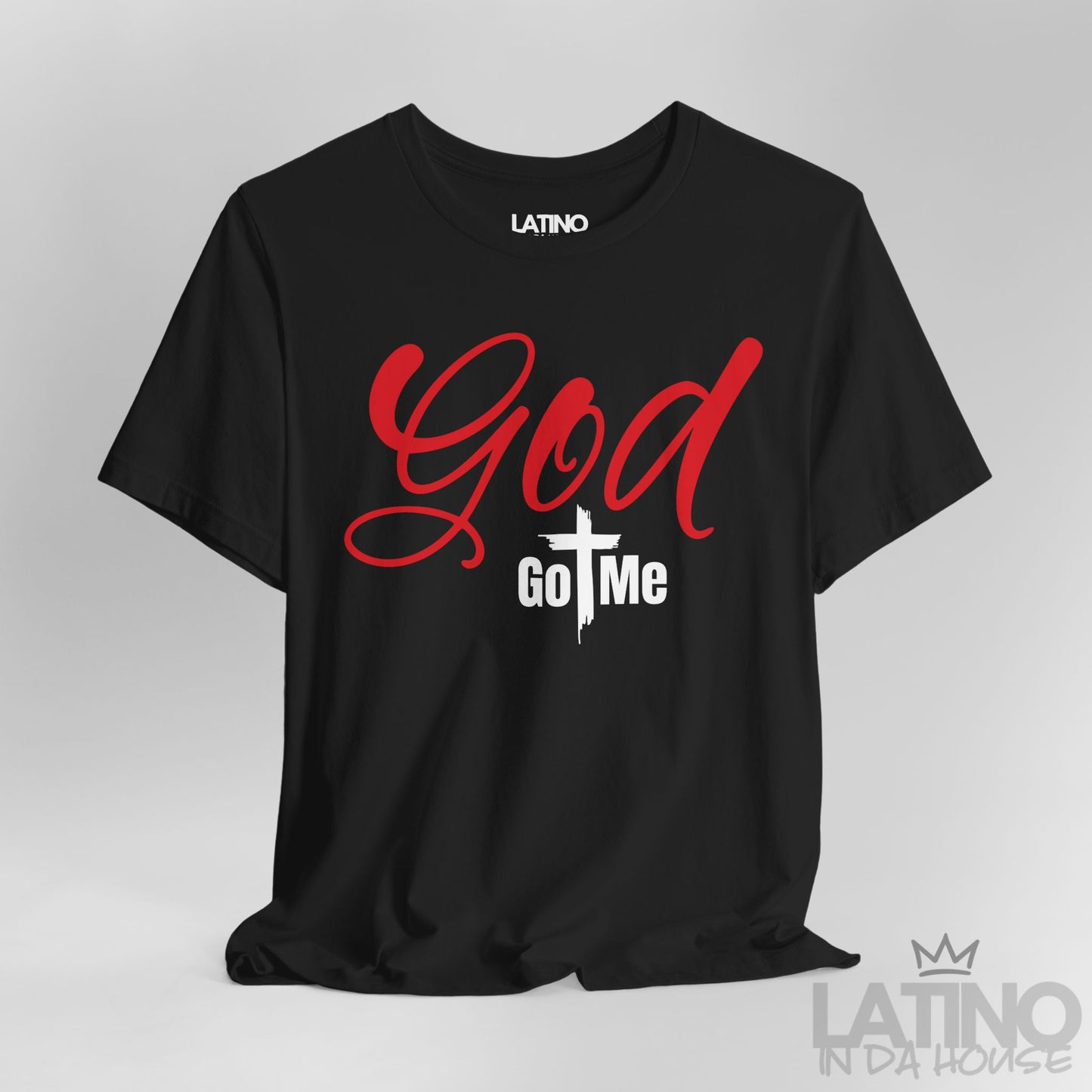 Close-up of God Got Me Black T-Shirt showing bold red text and cross-centered design. Latino In Da House