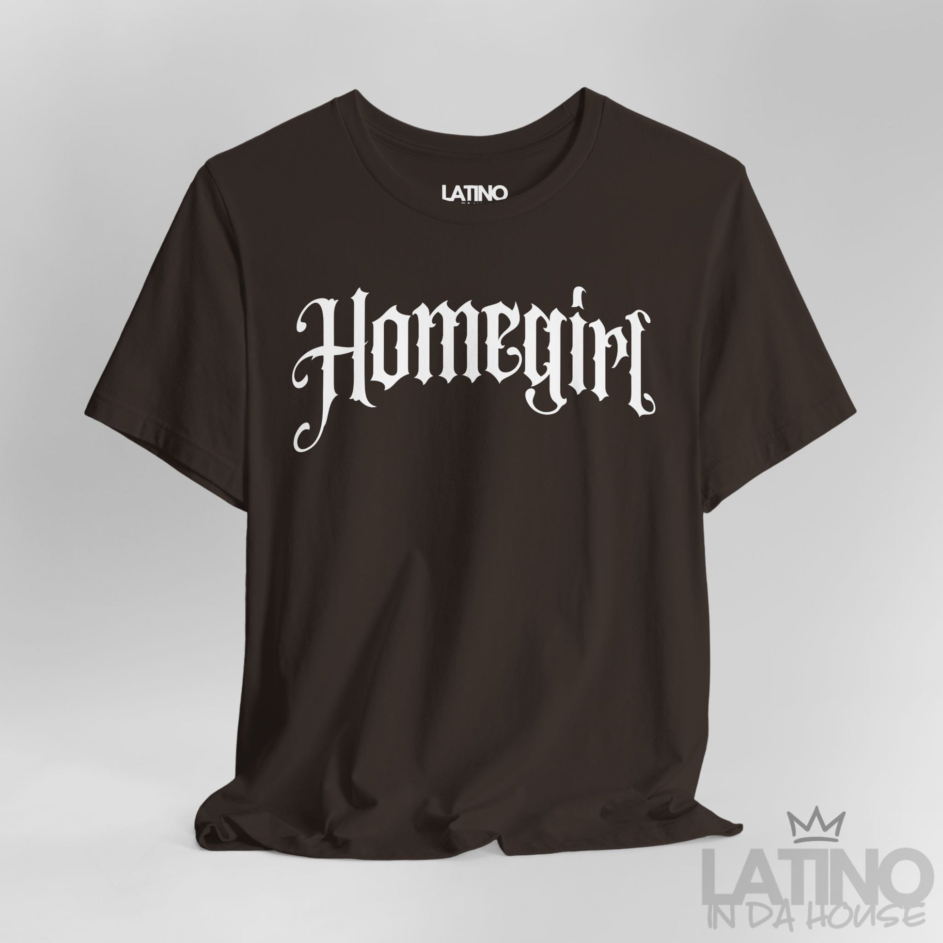 Close up Brown “Homegirl” T-shirt with white gothic font, Latino In Da House style.
