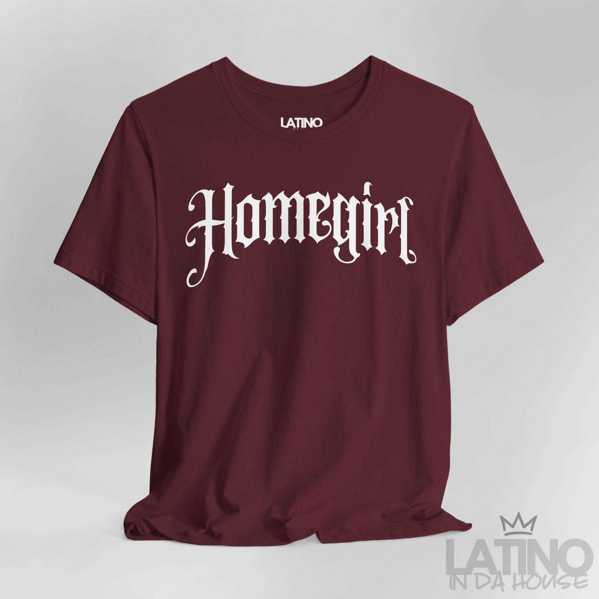 Close up Maroon “Homegirl” T-shirt with white gothic font, Latino In Da House style.