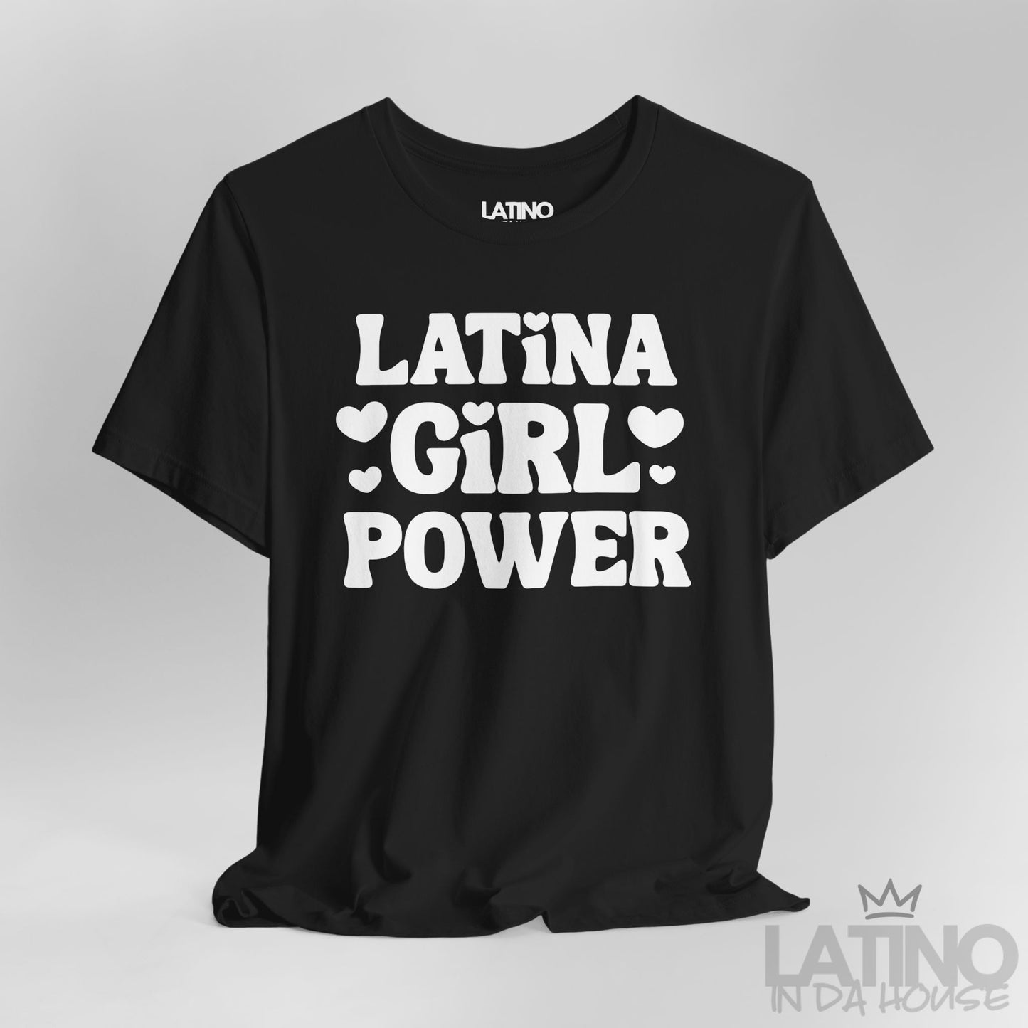 Close-up of black T-shirt with white “Latina Girl Power” text and heart accents. Latino In Da House