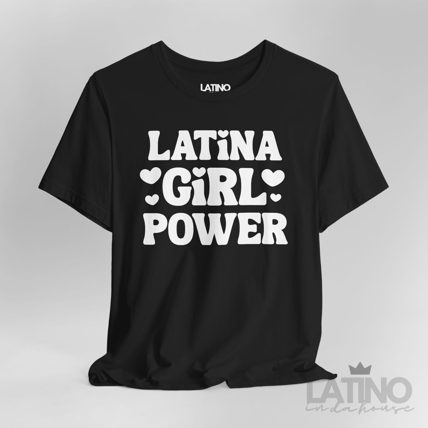Closeup of Latina Girl Power T-Shirt in black with bold white lettering and heart accents. Latino In Da House
