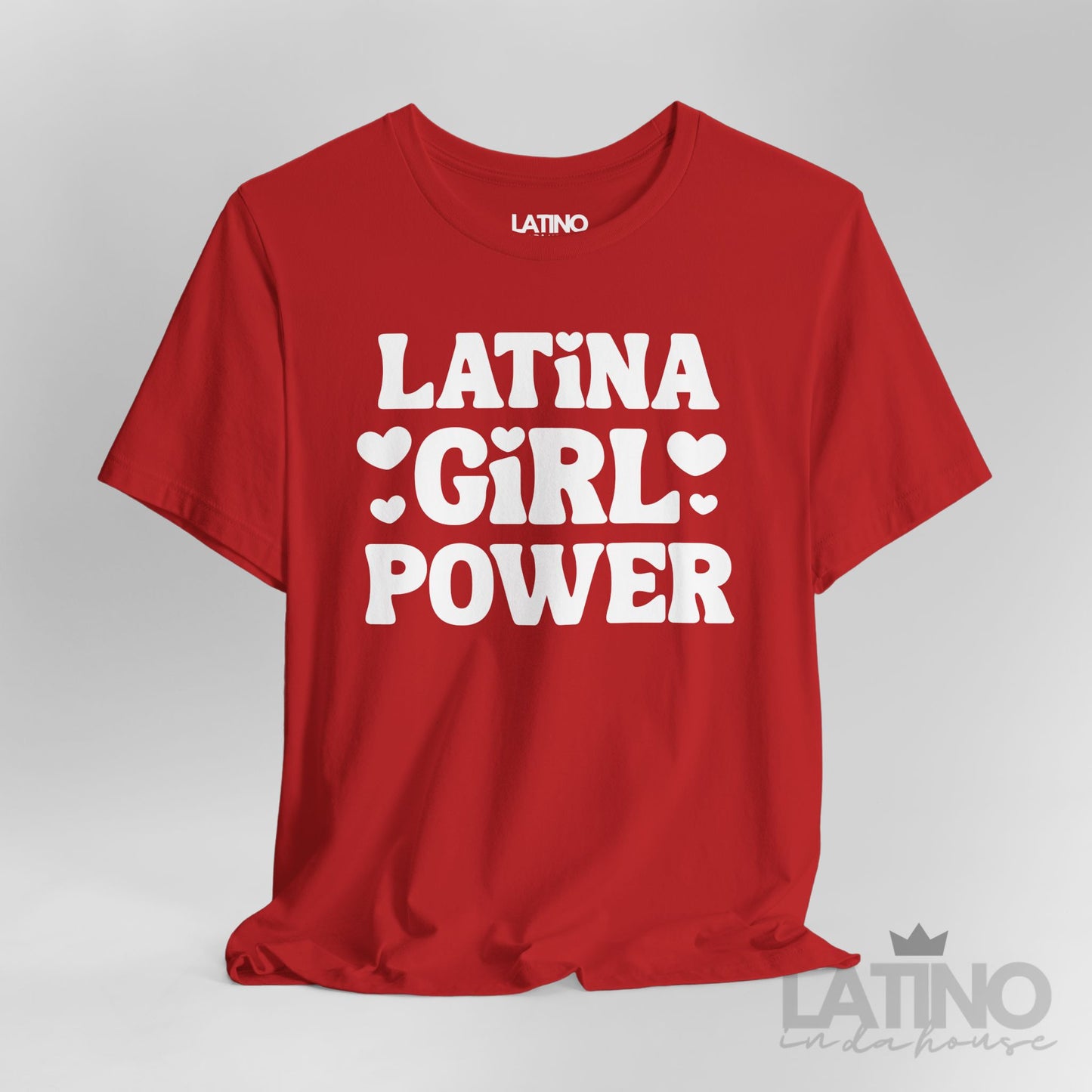 Closeup of Latina Girl Power T-Shirt in red with bold white lettering and heart accents. Latino In Da House