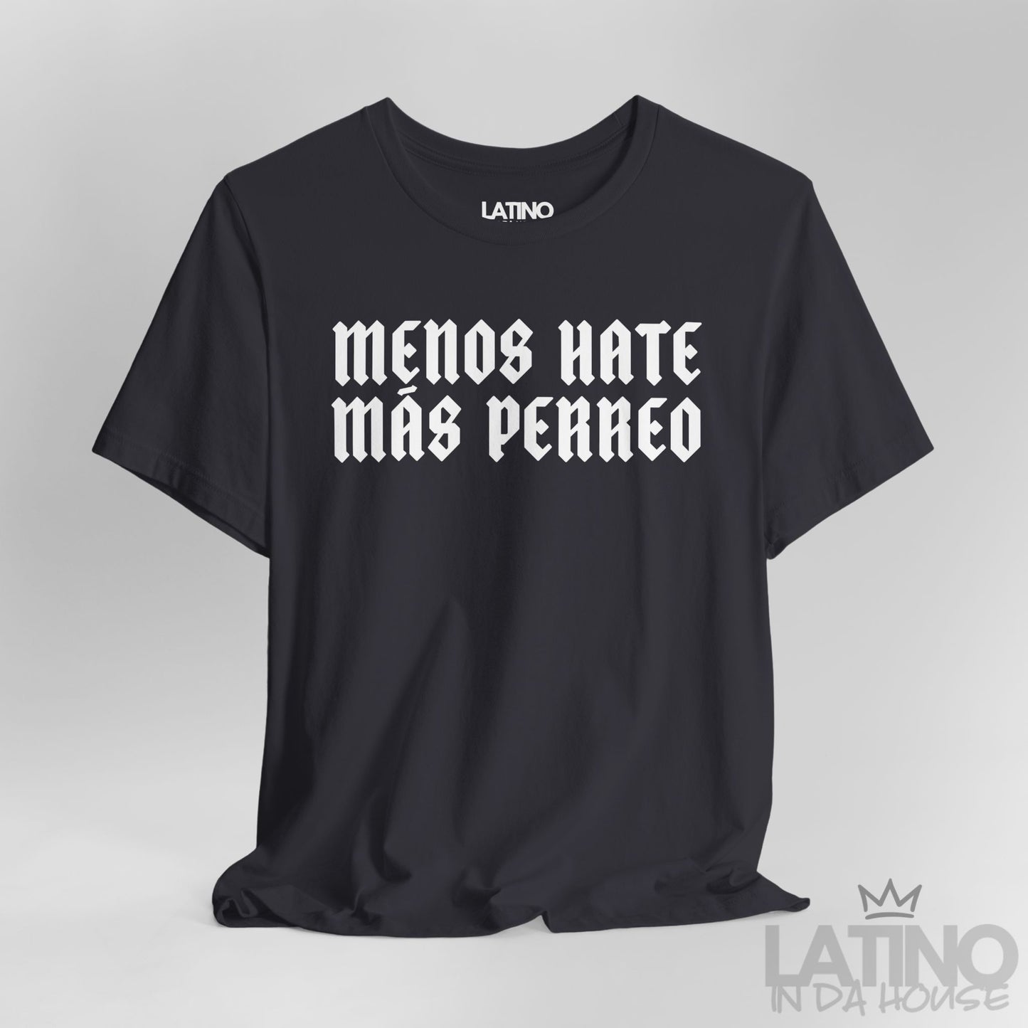 Close-up view of Menos Hate Más Perreo T-Shirt in dark grey with bold white gothic lettering. Latino In Da House