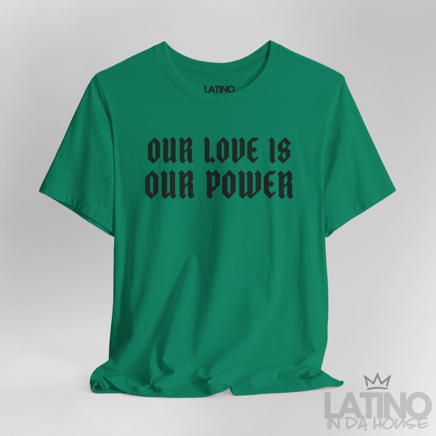 Close-up of Our Love Is Our Power print on green tee. Latino In Da House