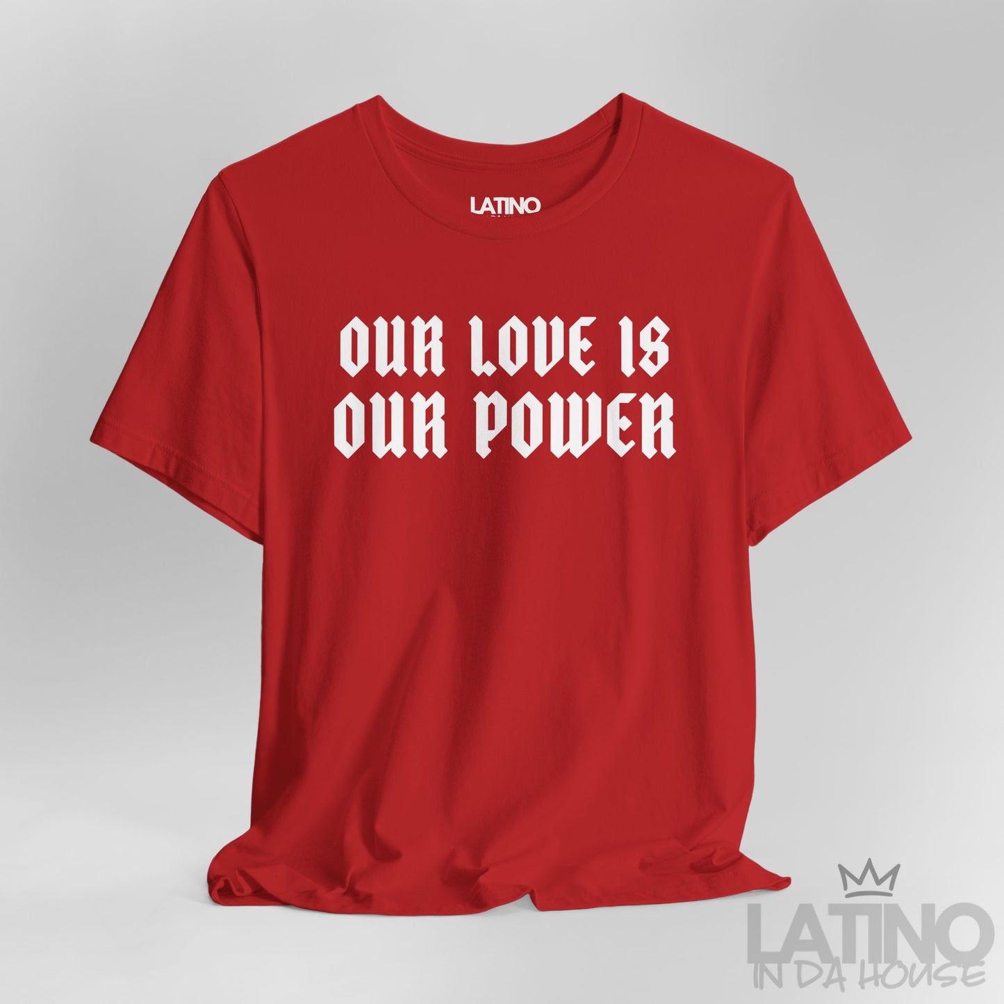 Close-up of Our Love Is Our Power print on red tee. Latino In Da House