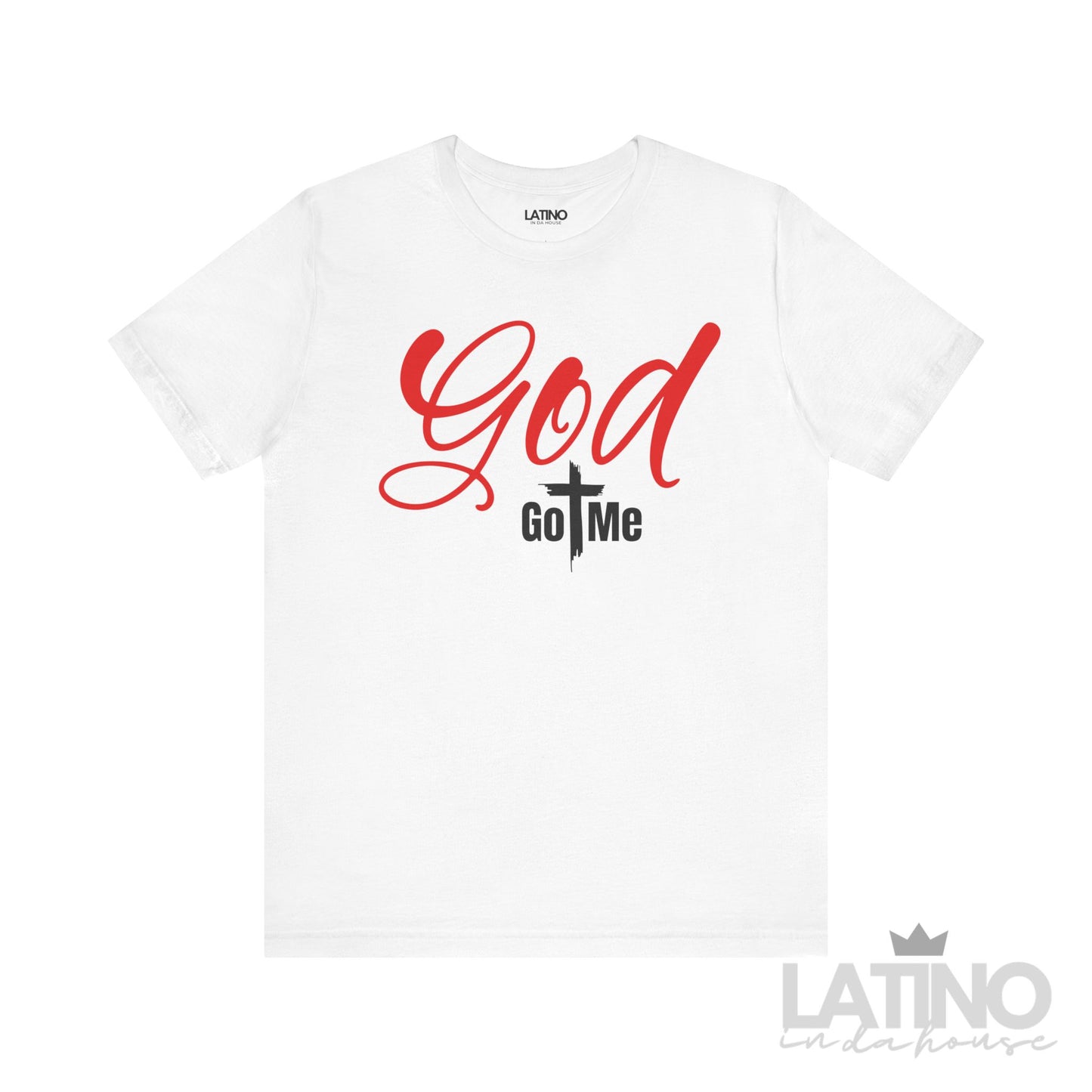 “White T-shirt with the phrase ‘God Got Me’ — ‘God’ in bold red script font, ‘Got Me’ in black block letters with a cross forming the ‘T’.”