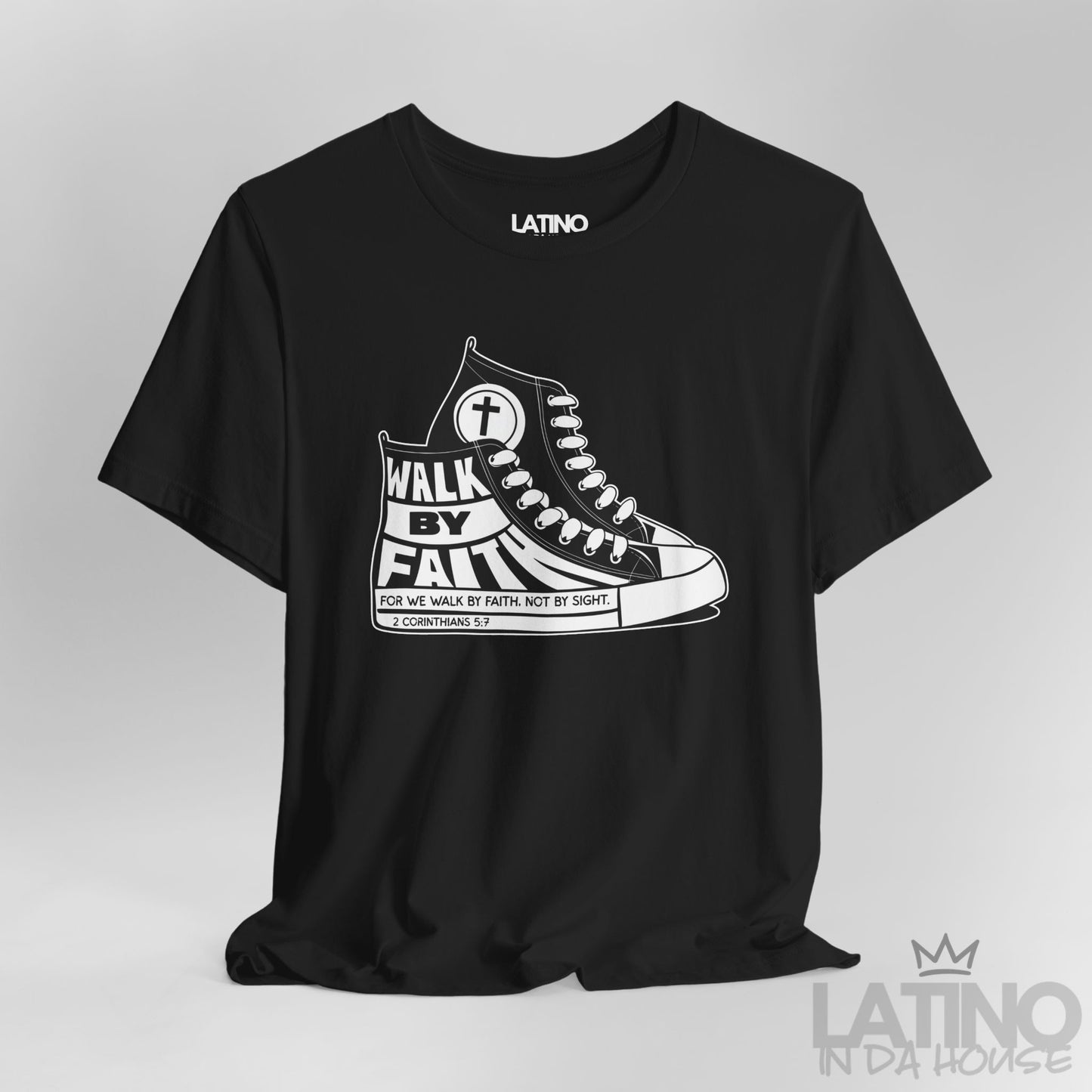 Close-up of Walk By Faith Black T-shirt showing sneaker details and 2 Corinthians 5:7 text on sole. Latino In Da House