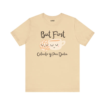 Beige t-shirt with coffee cup and text design on a white background but first cafecito y pan Dulce