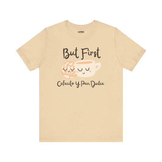 Beige t-shirt with coffee cup and text design on a white background but first cafecito y pan Dulce