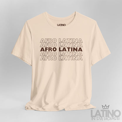 Close-up of Afro Latina T-Shirt design in brown text on cream fabric. Latino In Da House 