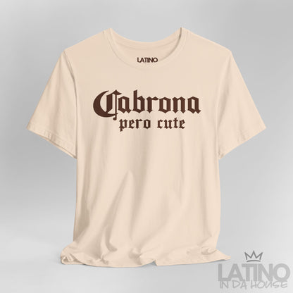 Close-up of soft cream “Cabrona Pero Cute” T-Shirt white gothic text. Latino In Da House 