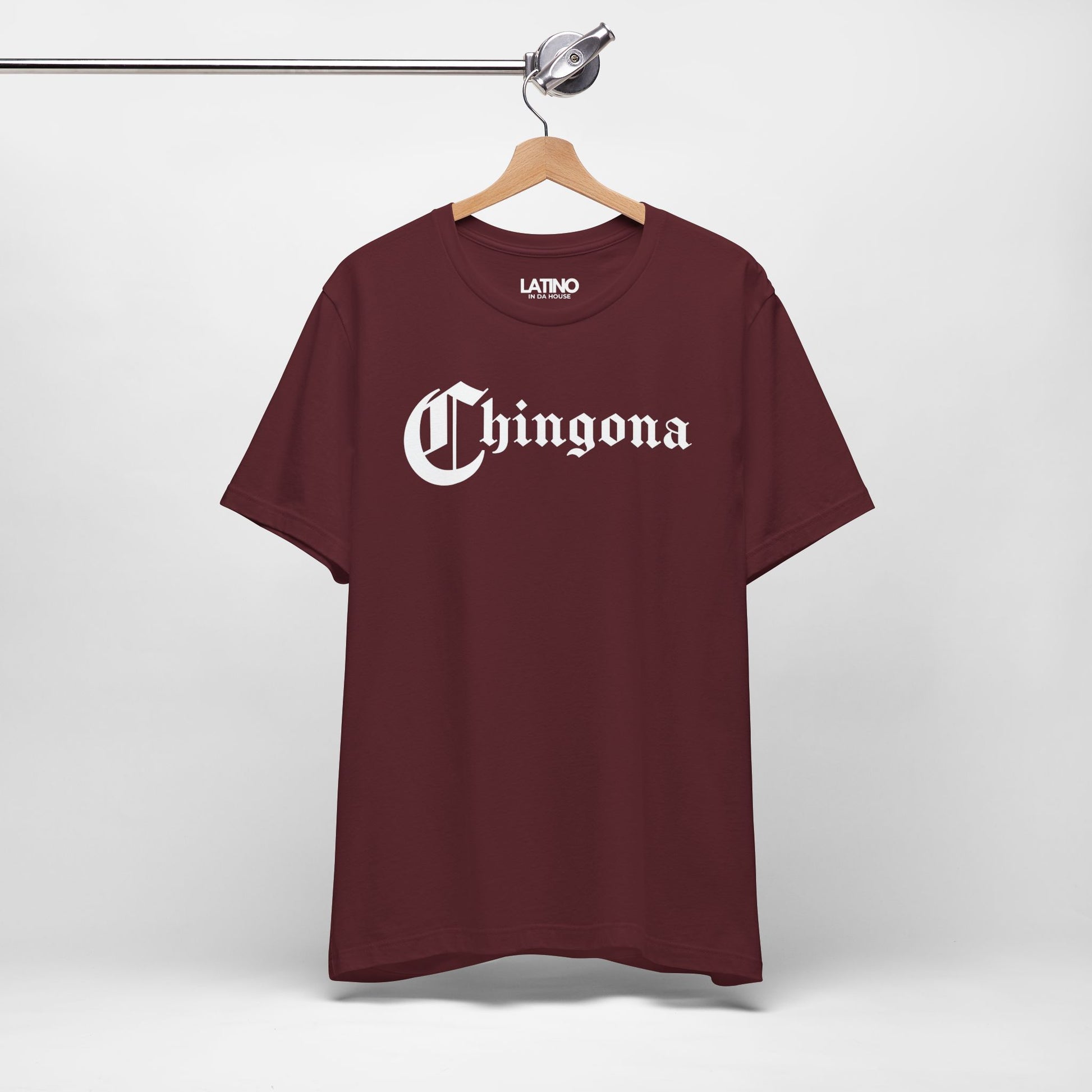 Hanged-up of Chingona T-Shirt in maroon with bold gothic white lettering. Latino In Da House