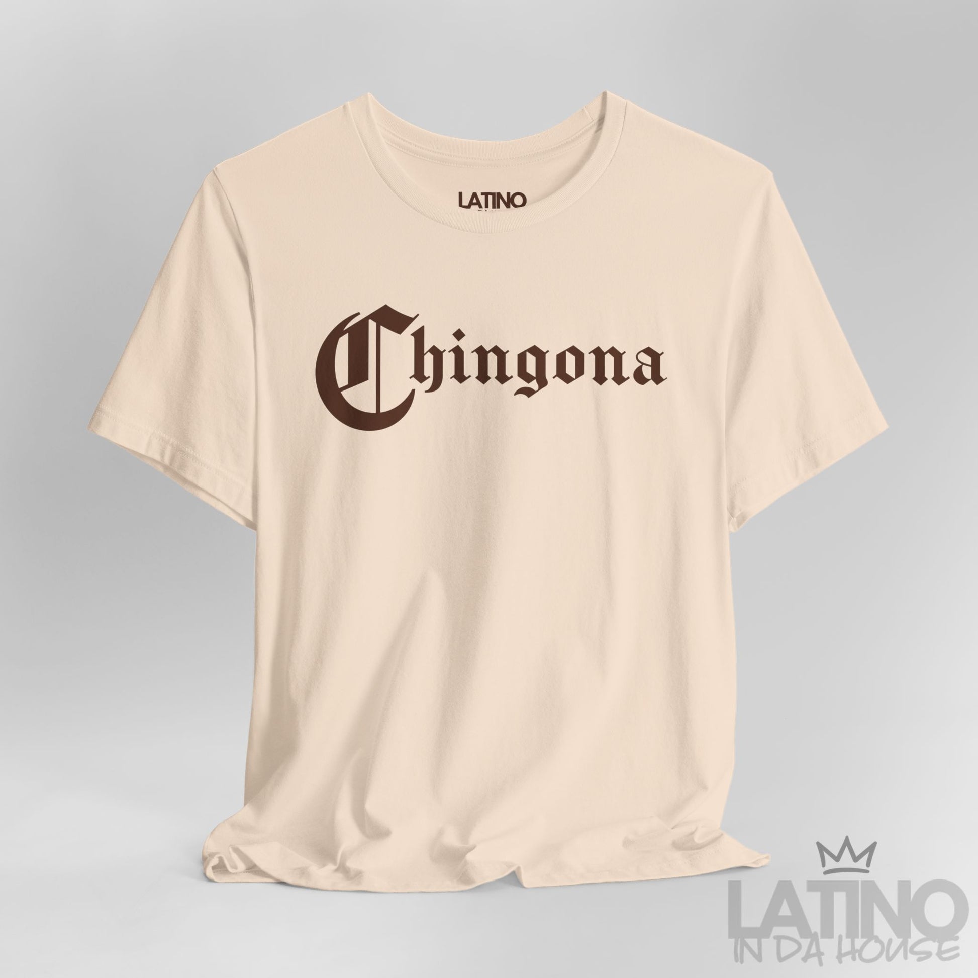 Close-up of Chingona T-Shirt in soft cream with bold gothic brown lettering. Latino In Da House 
