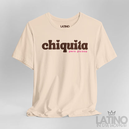 Close-up of soft cream “Chiquita Pero Picosa” T-shirt design showing detail. Latino In Da House 