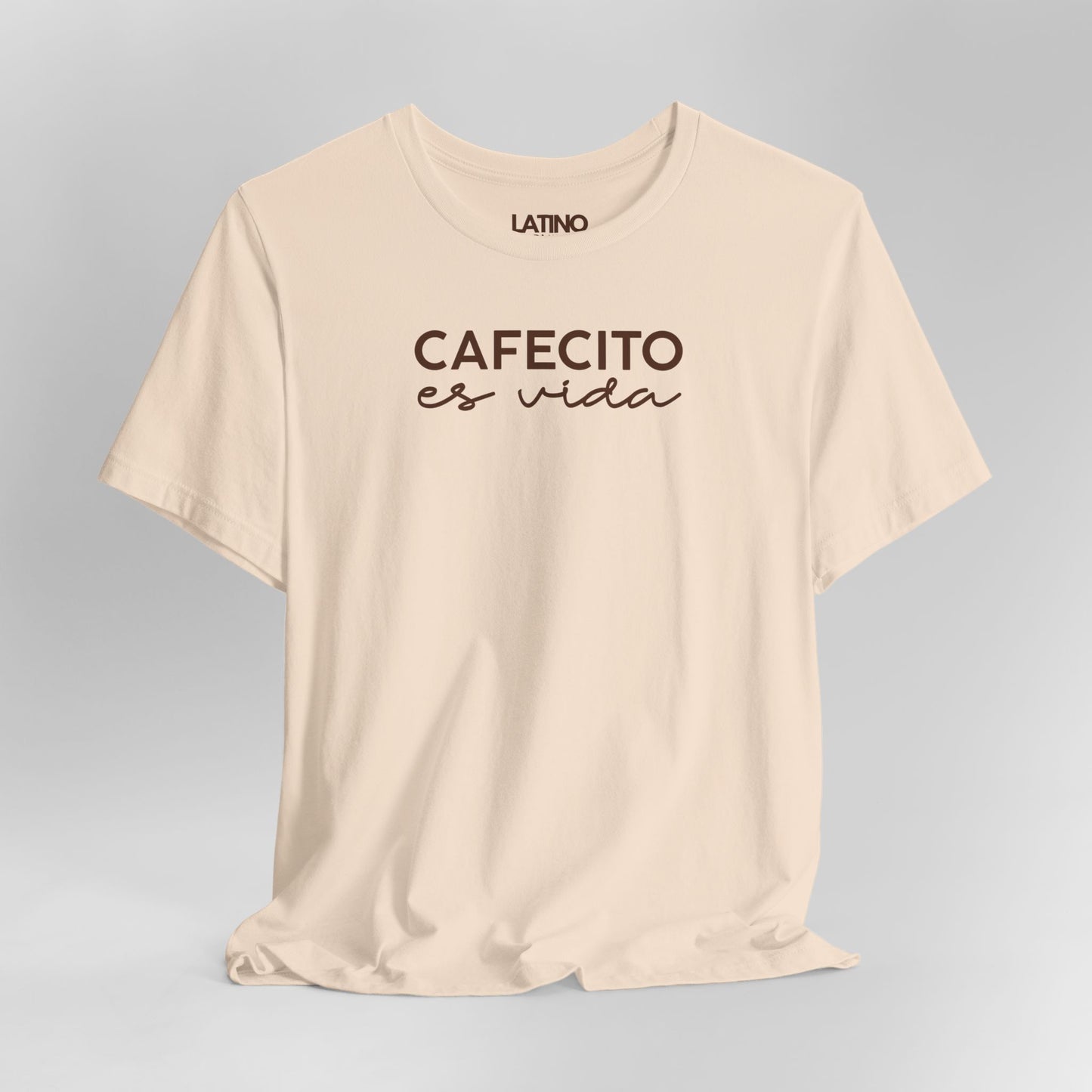Close Up Cafecito Es Vida T-Shirt in soft cream with brown cursive text - Latino In
Da House