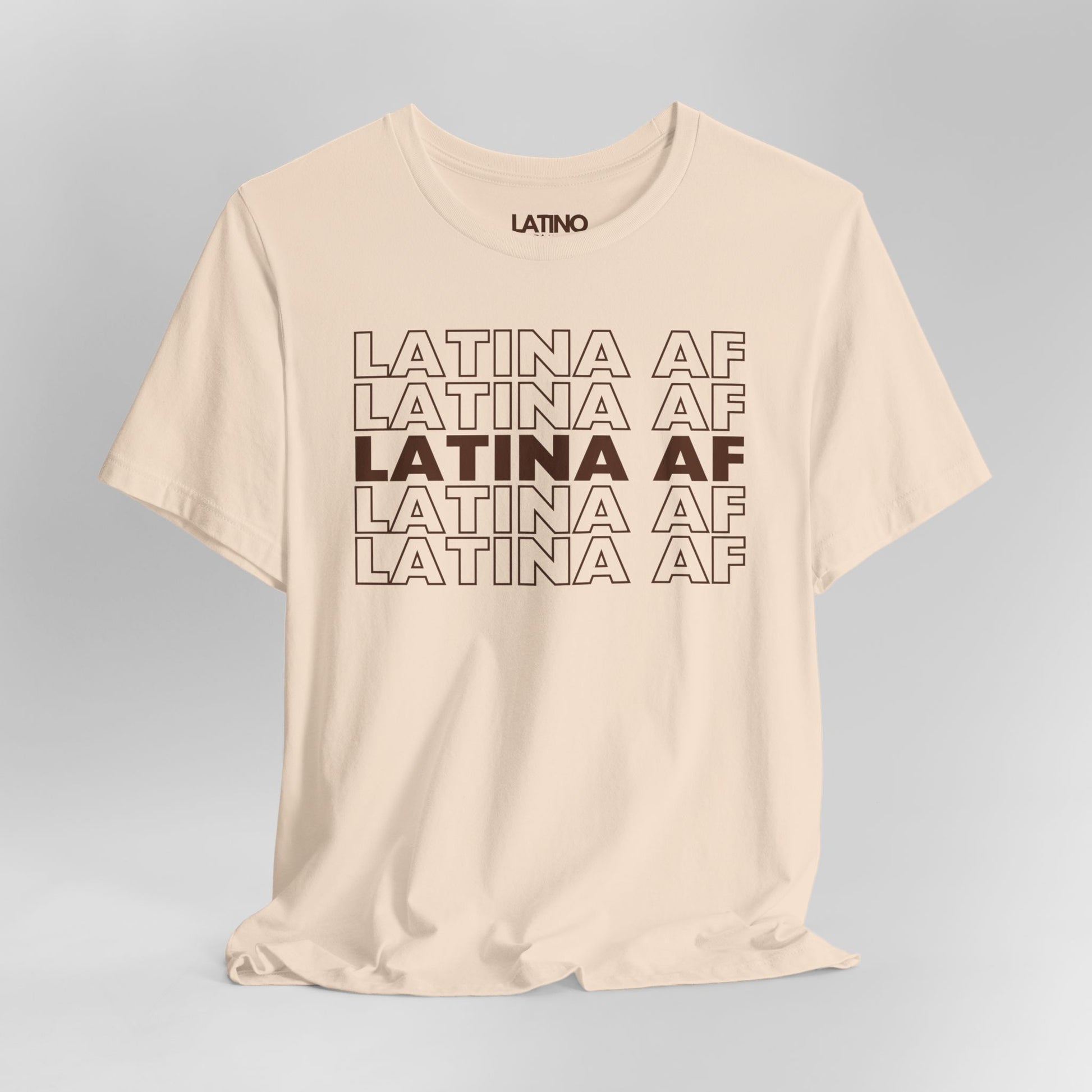 Close Up Soft cream Latina AF T-shirt with bold repeated design in brown text - Latino In Da House apparel.