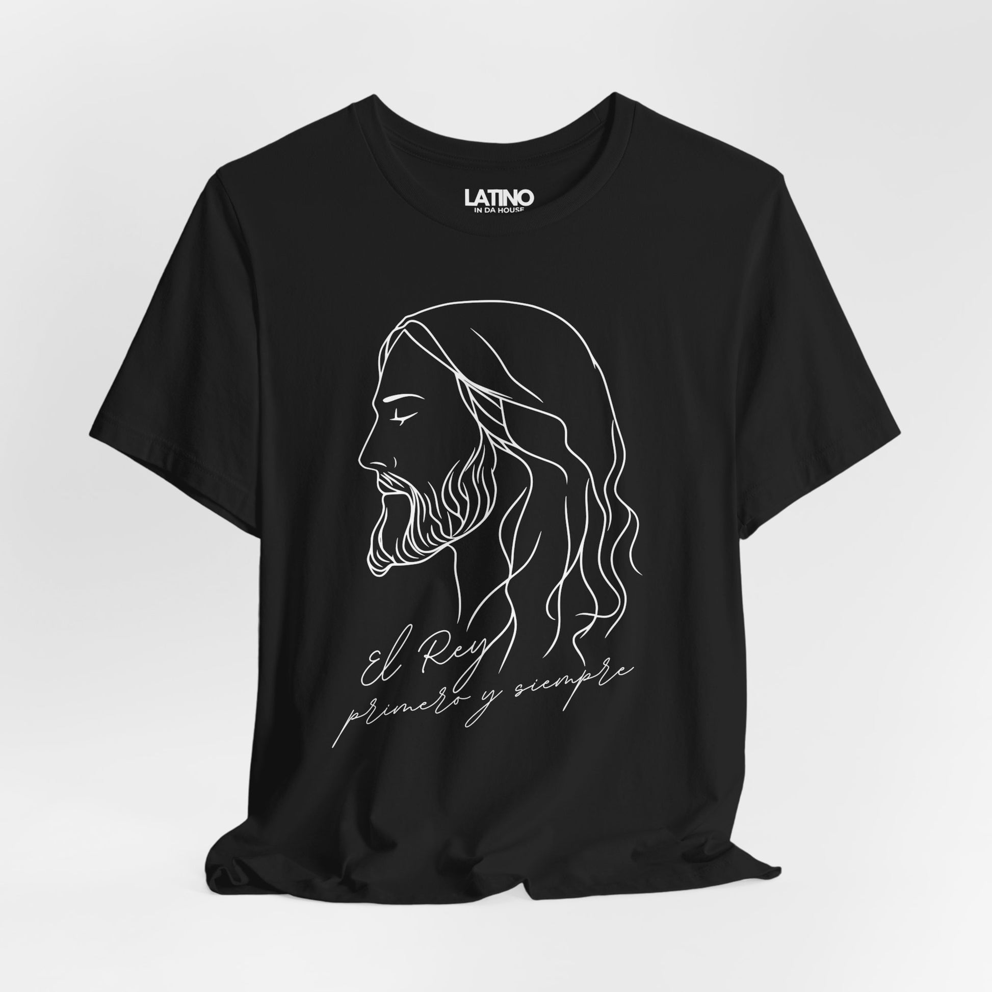 Close-up of El Rey Primero y Siempre T-
Shirt white print on soft black cotton.
Latino In Da House