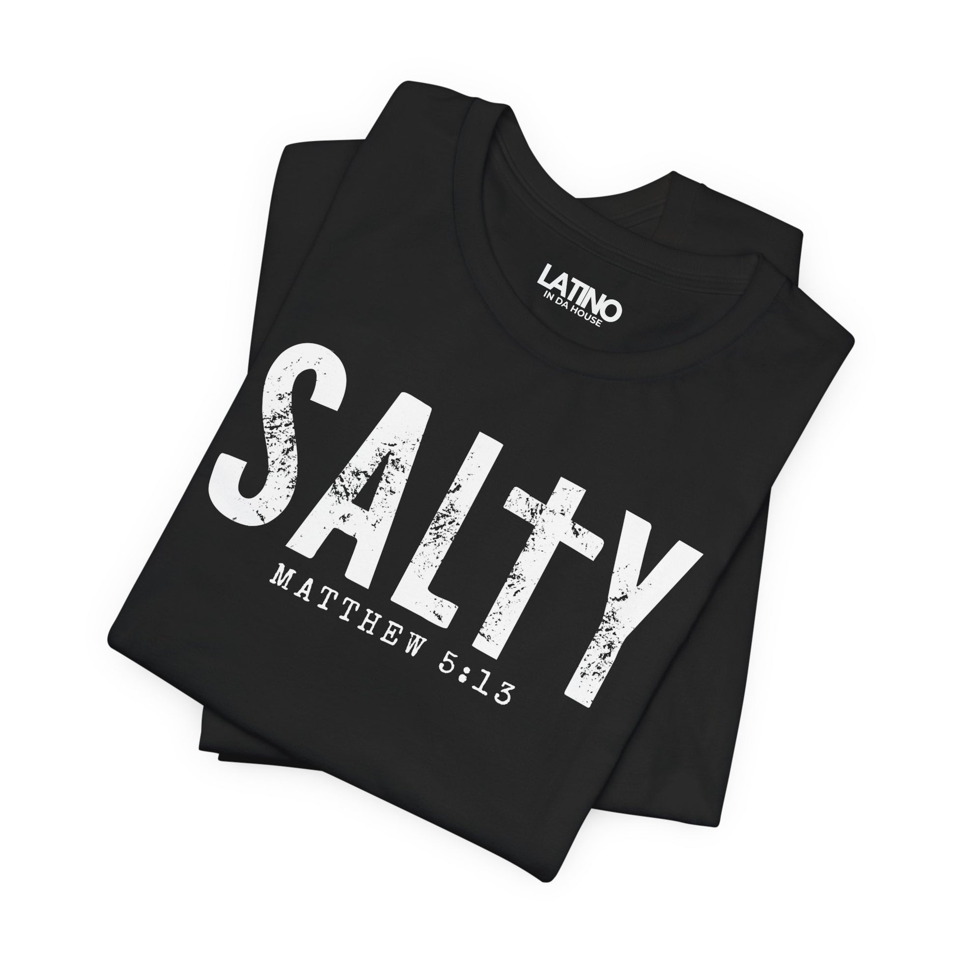 Folded Salty Matthew 5:13 T-Shirt in black with distressed white text and cross design - Latino In Da House