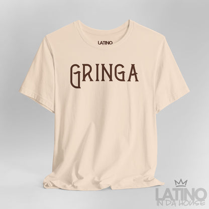 Close-up of soft cream Gringa T-Shirt design with bold gothic text. Latino In Da House 