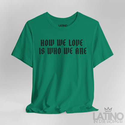 Close-up view of How We Love Is Who We Are T-Shirt in Kelly green with bold black gothic lettering. Latino In Da House 