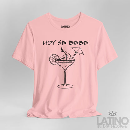 Close-up of pink T-shirt design with Hoy Se Bebe phrase and cocktail graphic. Latino In Da House 
