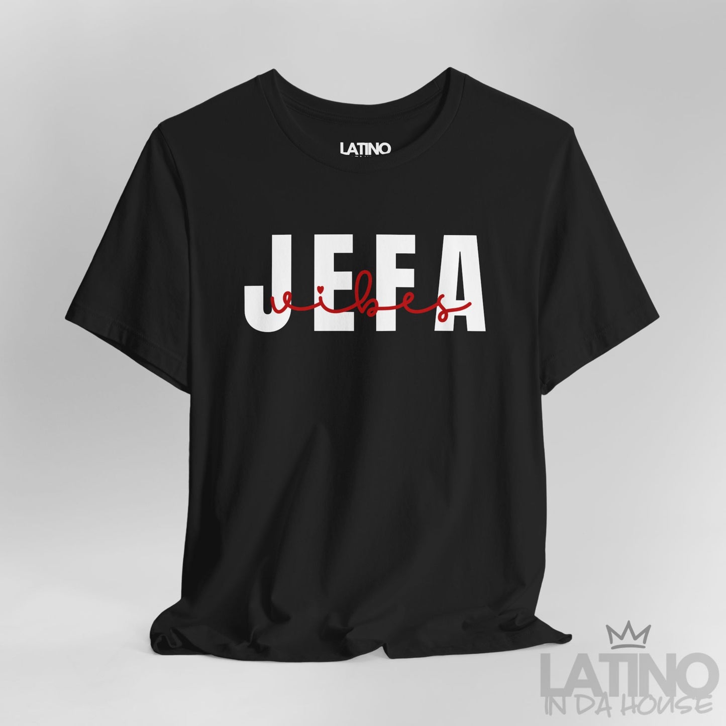 Close-up of Jefa Vibes text design in white block letters with red script on black T-shirt. Latino In Da House 