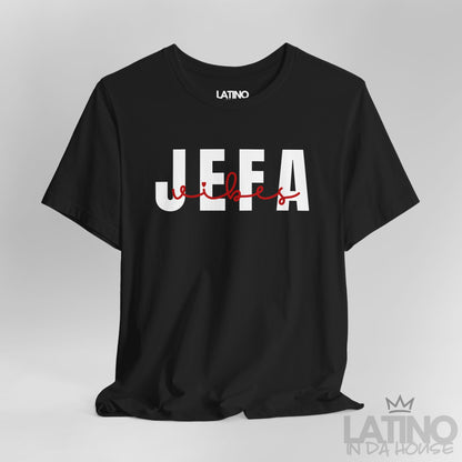Close-up of Jefa Vibes text design in white block letters with red script on black T-shirt. Latino In Da House 
