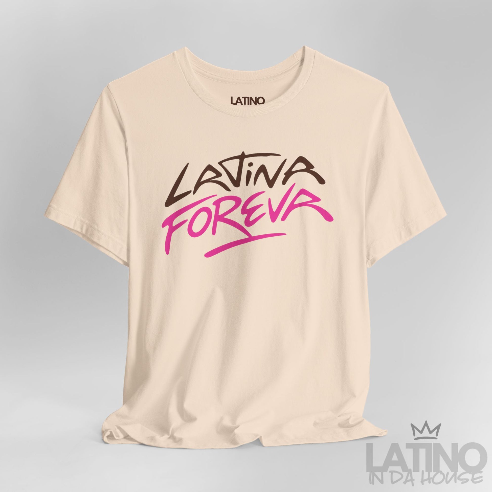 Close-up of Latina Foreva T-Shirt in soft cream with graffiti-style pink and brown lettering. Latino In Da House 