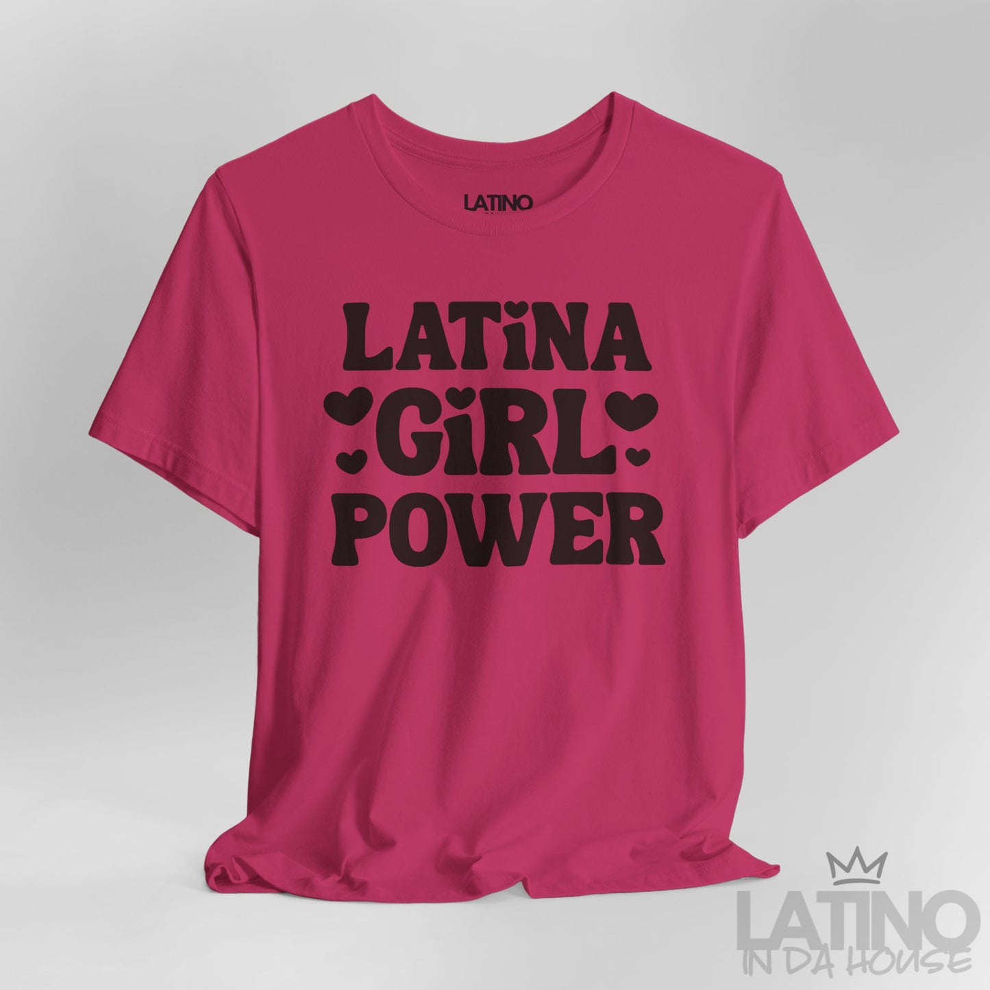 Close-up of berry hot pink T-shirt with black “Latina Girl Power” text and heart accents. Latino In Da House 