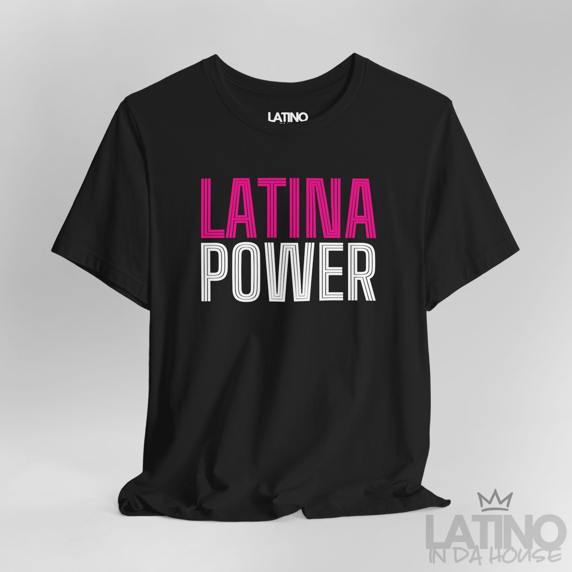 Close-up of black Latina Power T-shirt with pink and white retro outlined text. Latino In Da House 