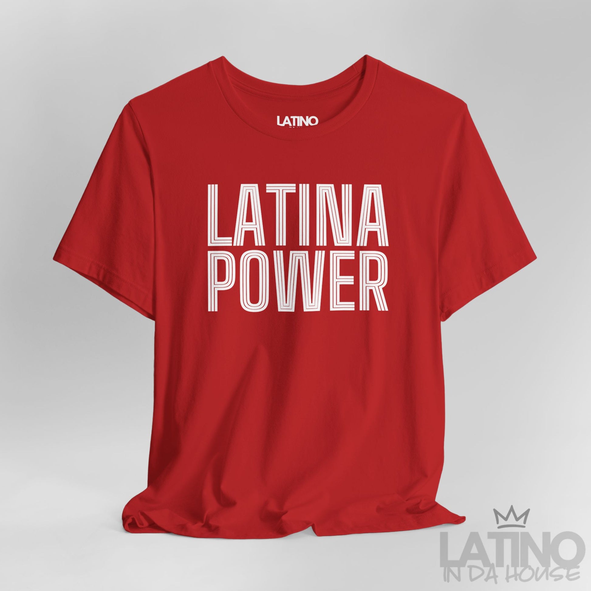 Close-up of red Latina Power T-shirt showing bold retro outlined text design. Latino In Da House 