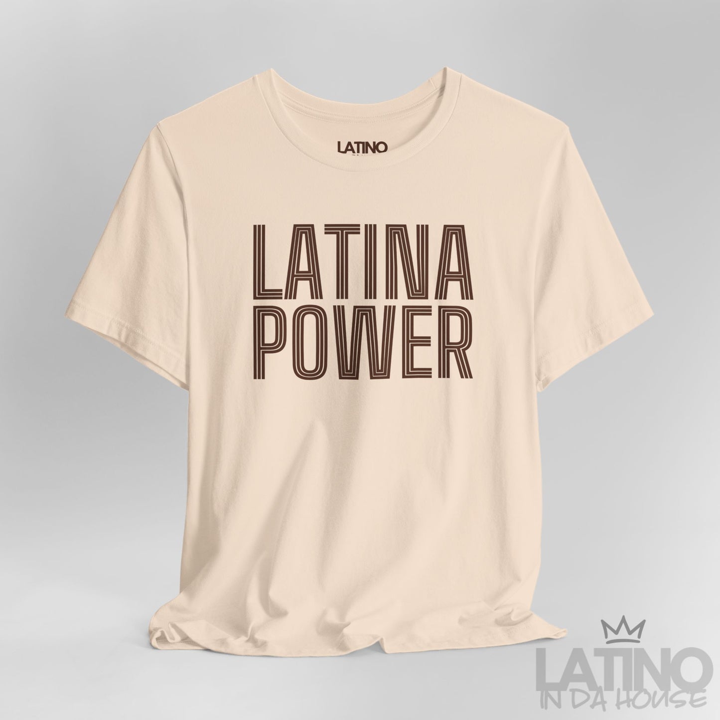 Close-up of soft cream Latina Power T-shirt featuring bold retro outlined font. Latino In Da House 