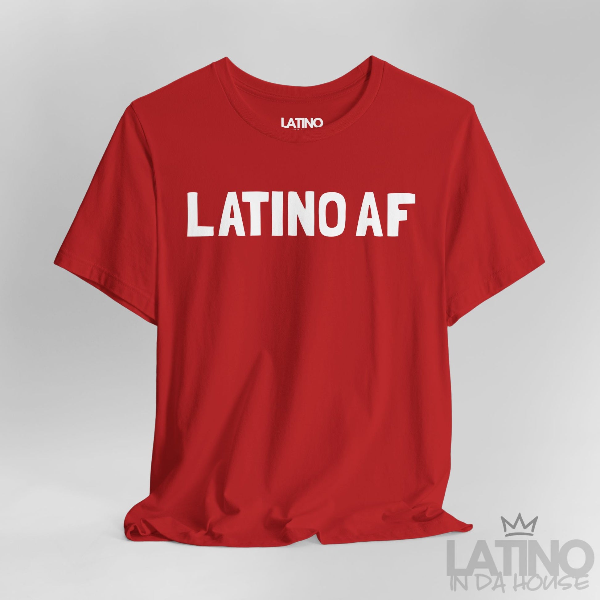 Close-up view of Latino AF T-Shirt in red with bold white lettering. Latino In Da House 