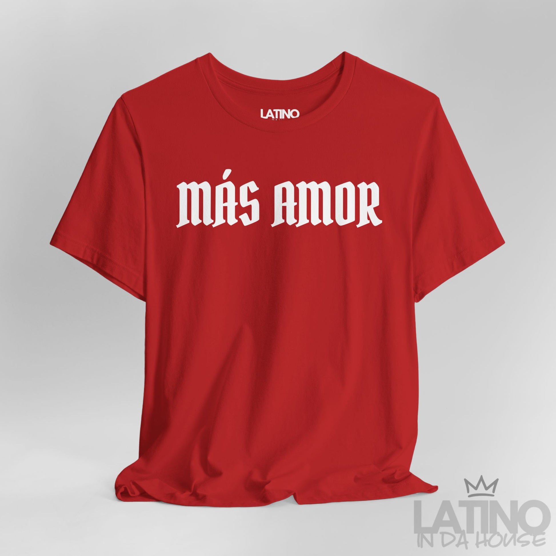 Close-up of red Más Amor T-shirt with bold white gothic lettering. Latino In Da House