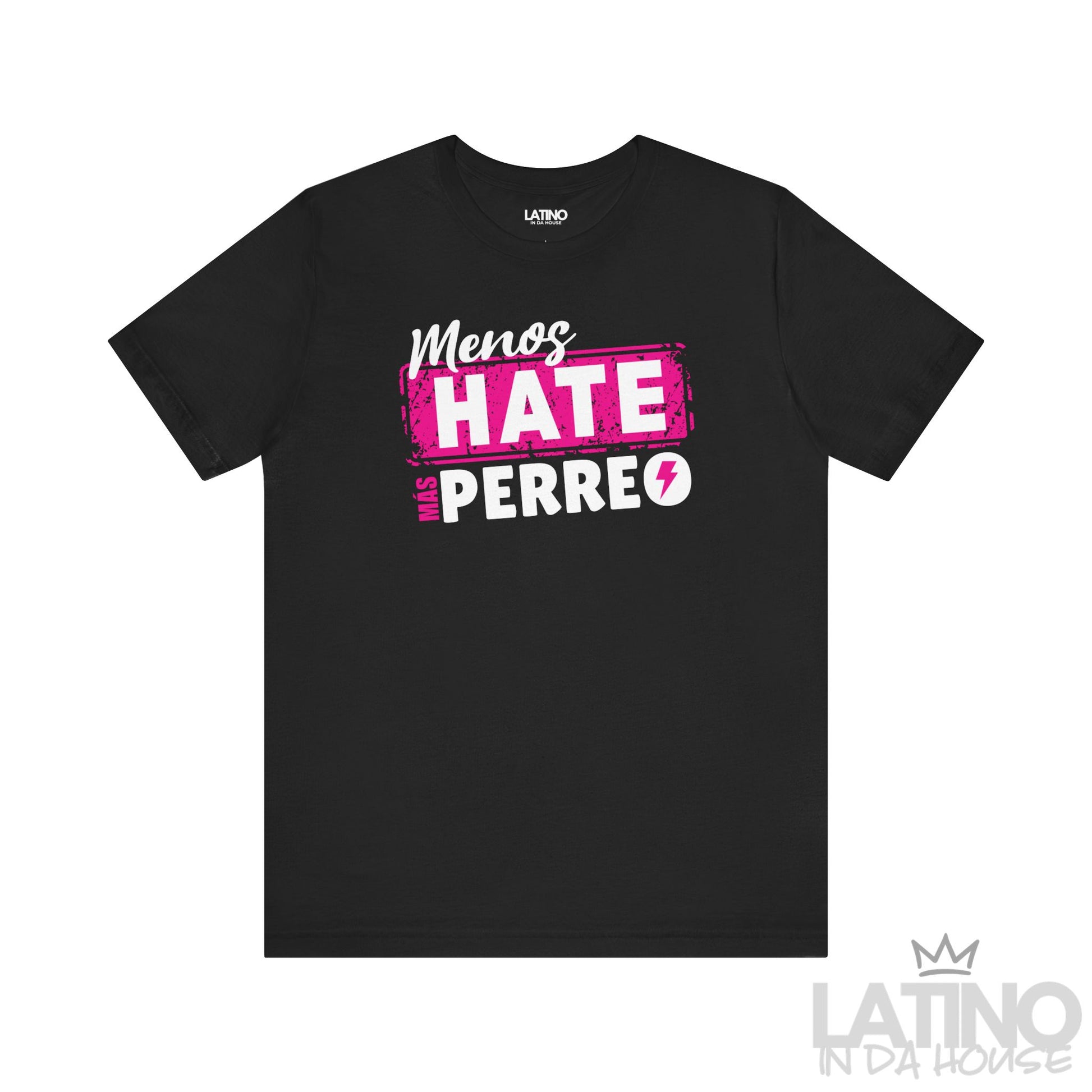 Flatlay of black T-shirt with bold pink and white design “Menos Hate Más Perreo,” Latin urban lifestyle shirt. Latino In Da House 