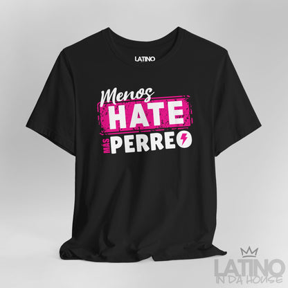 Black graphic tee with pink and white lettering “Menos Hate Más Perreo,” urban Latino streetwear mockup. Latino In Da House 