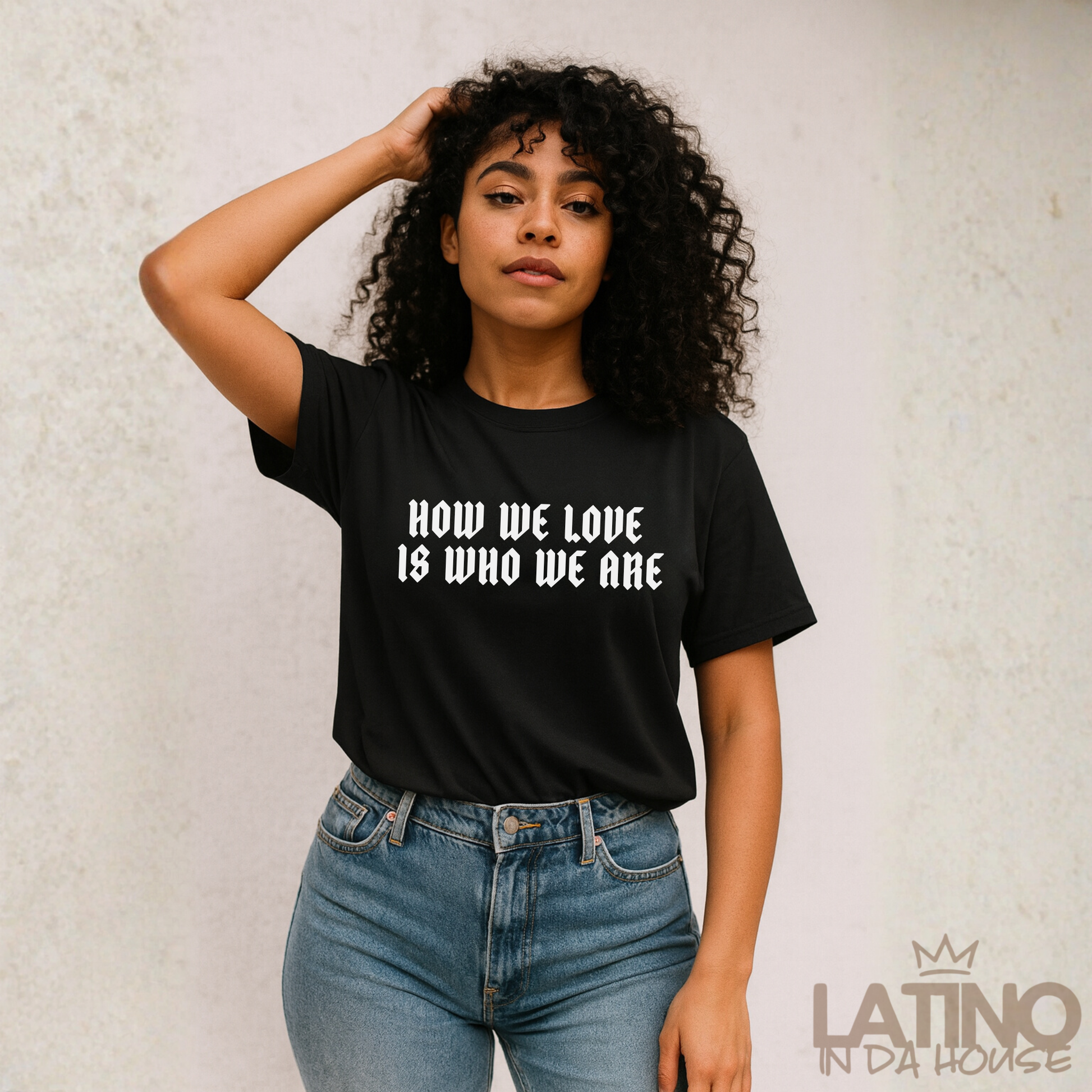 Model How We Love Is Who We Are T-Shirt in black with bold white gothic lettering. Latino In Da House 