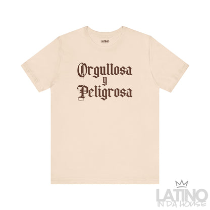 Orgullosa y Peligrosa T-shirt in bold gothic brown text on soft cream background – Latino In Da House