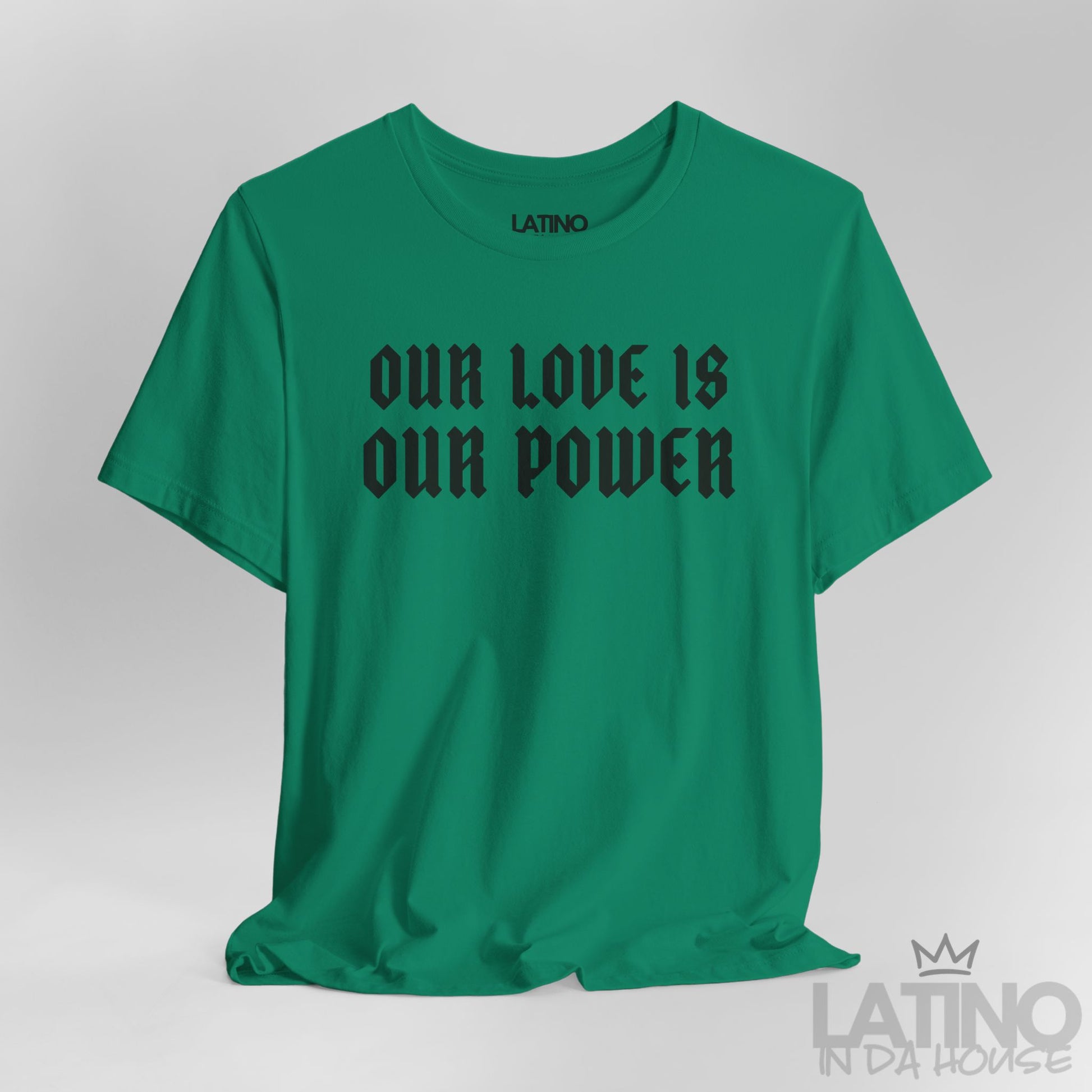 Close-up of Our Love Is Our Power print on green tee. Latino In Da House