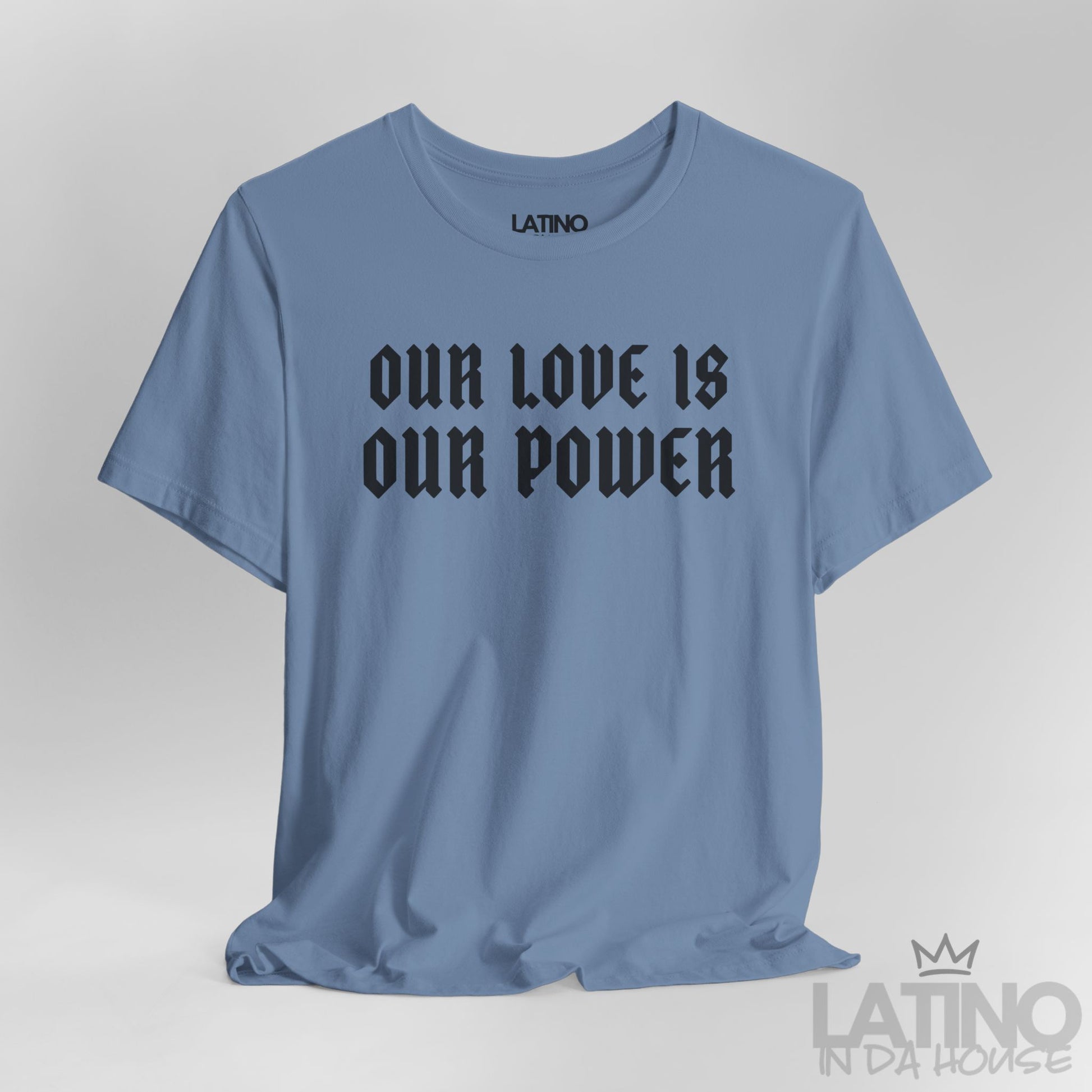 Close-up of Our Love Is Our Power print on steel blue tee. Latino In Da House