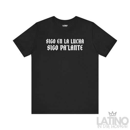 Black T-shirt with bold gothic white text reading “Sigo en la lucha, sigo pa’lante.” Latino In Da House