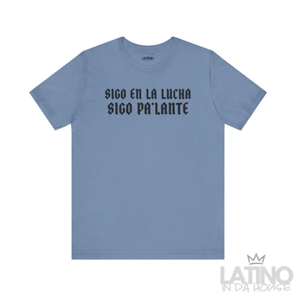 Steel Blue T-shirt with bold gothic black  text reading “Sigo en la lucha, sigo pa’lante.” Latino In Da House