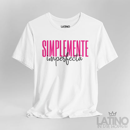 Closeup of white T-shirt with bold pink and black text reading “Simplemente Imperfecta” – Latino In Da House
