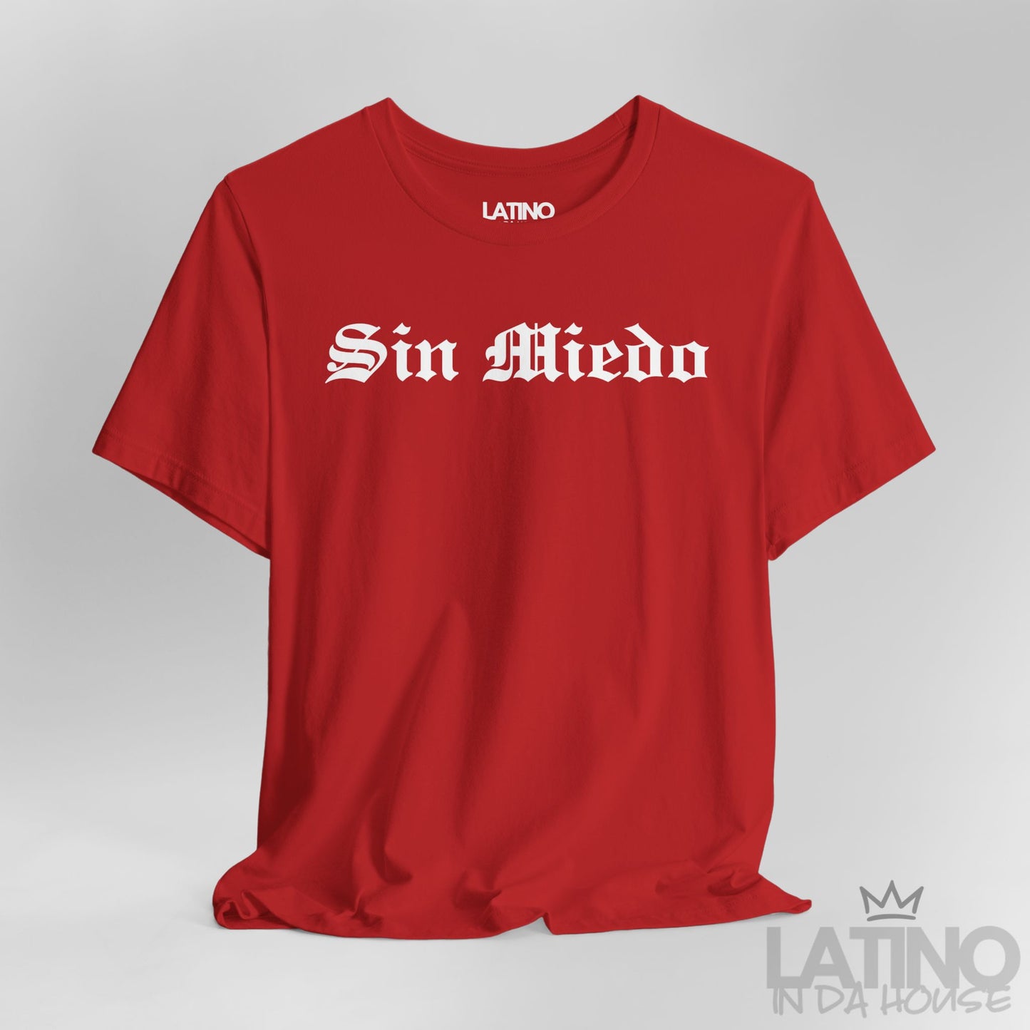 Close-up view of Sin Miedo T-Shirt in red with bold white gothic lettering. Latino In Da House 