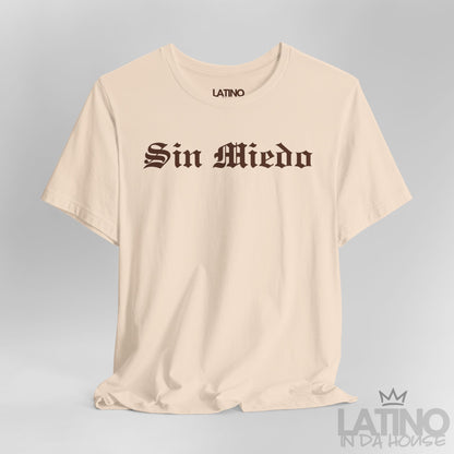 Close-up view of Sin Miedo T-Shirt in soft cream with bold brown gothic lettering. Latino In Da House 